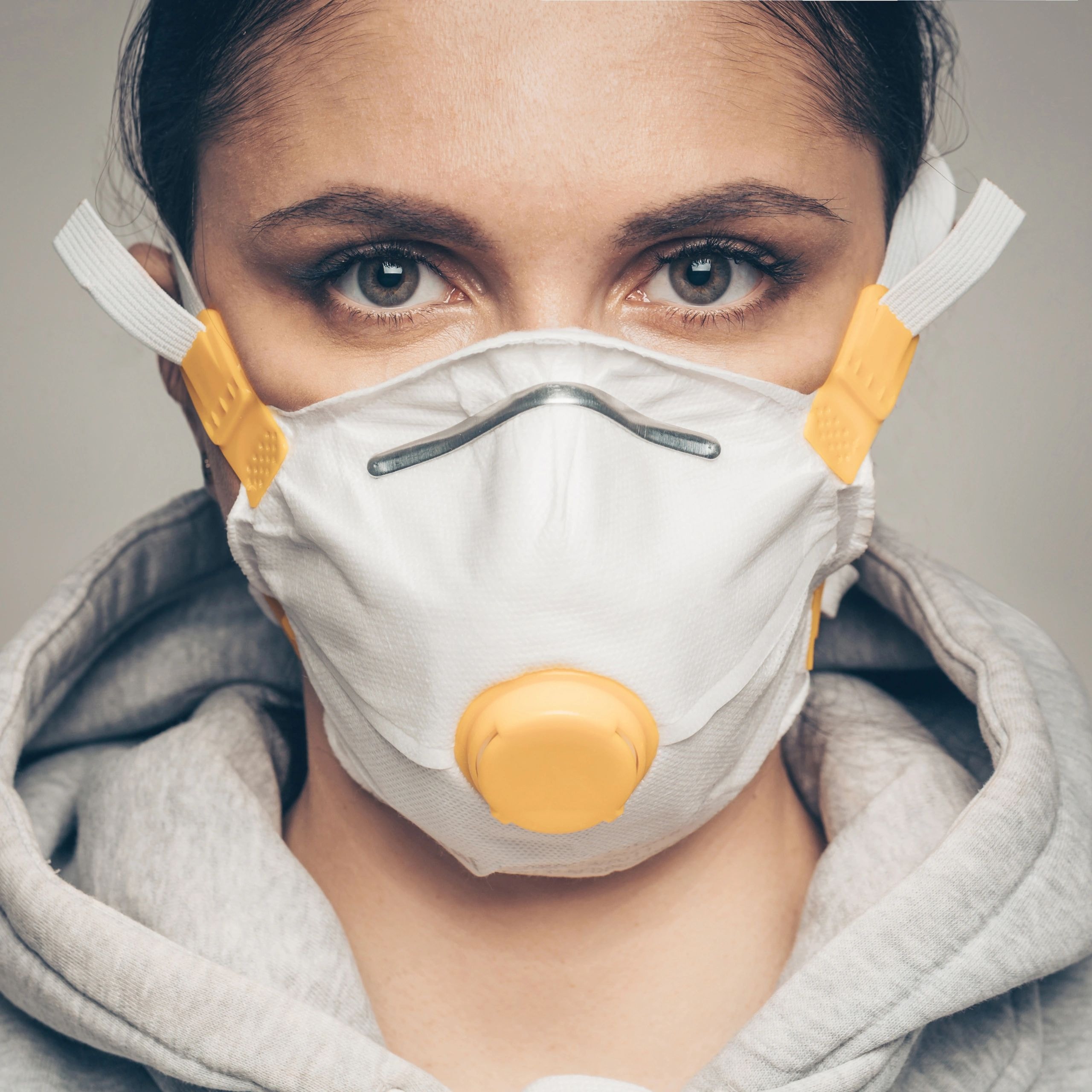 Woman wearing N95 respirator mask — fit testing services